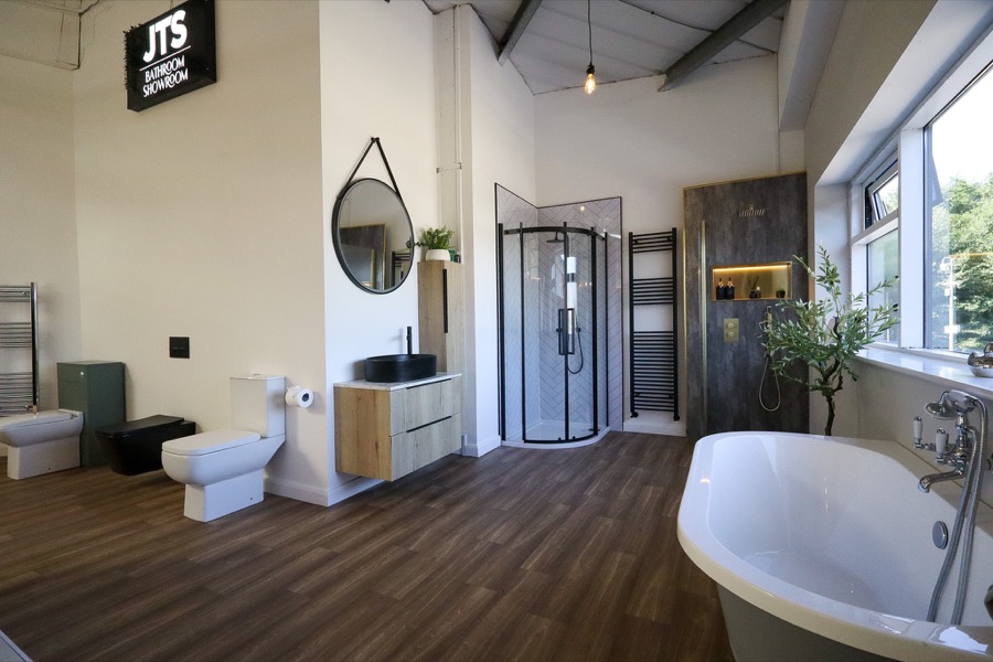 Wide bathroom showroom view inside JTS Plumbing and Heating Supplies Ltd